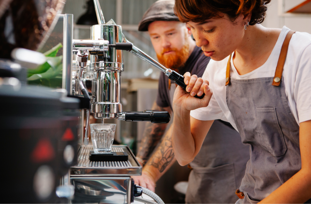 Barista using a manual espresso machine