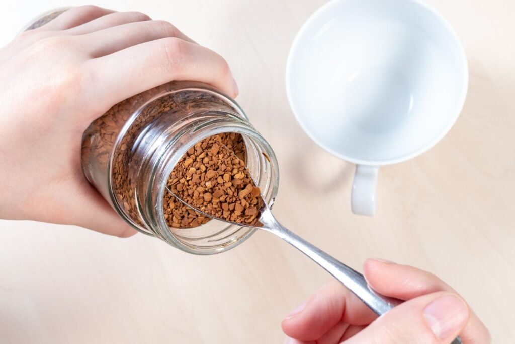 Preparing a cup of instant coffee